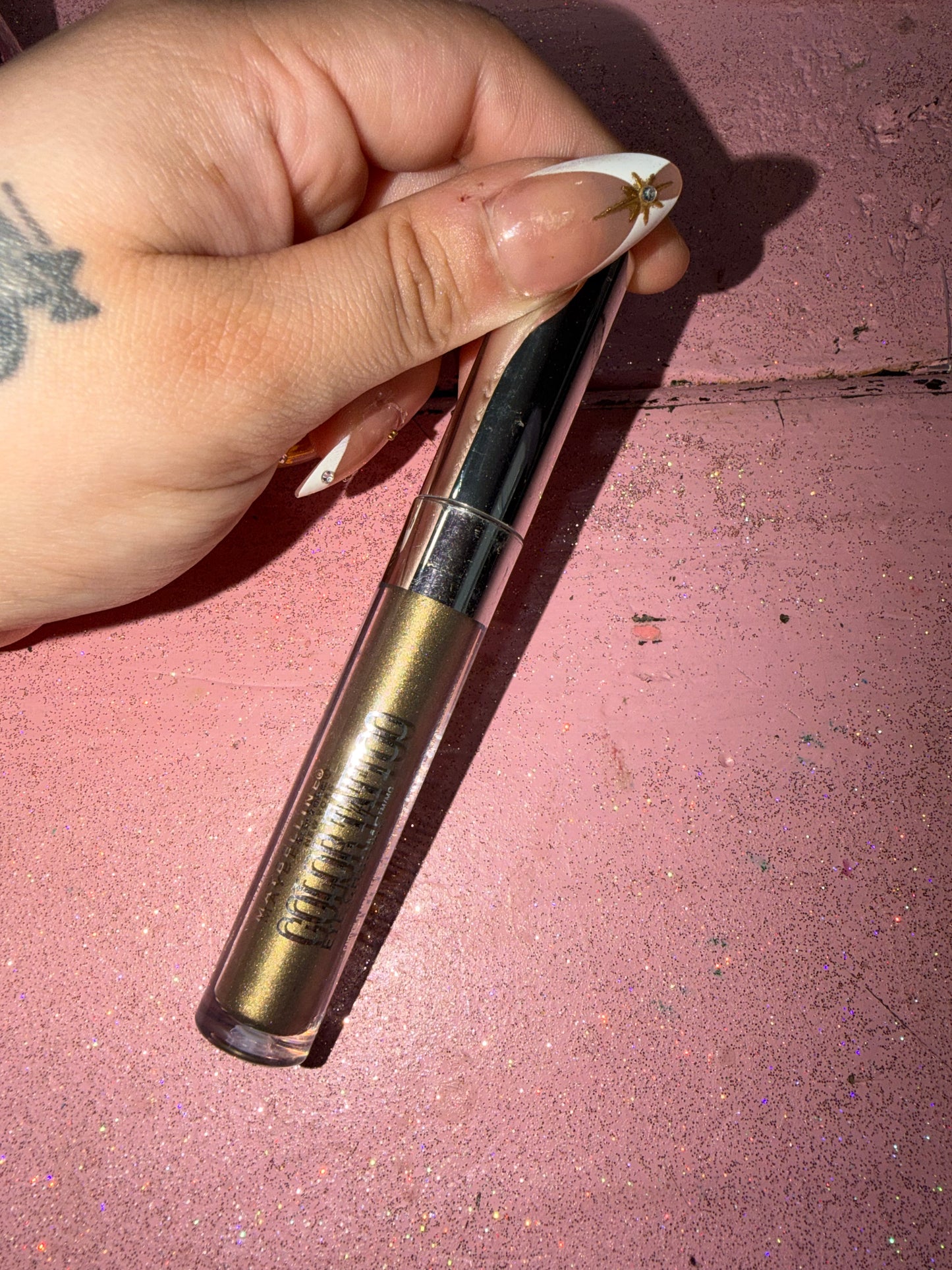 Green/gold glitter eyeshadow stick