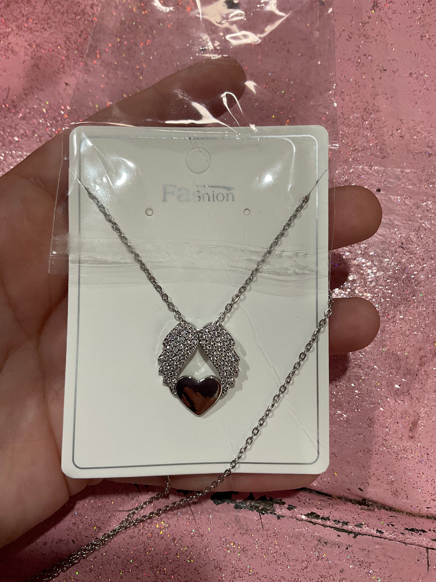 Silver heart with wings necklace
