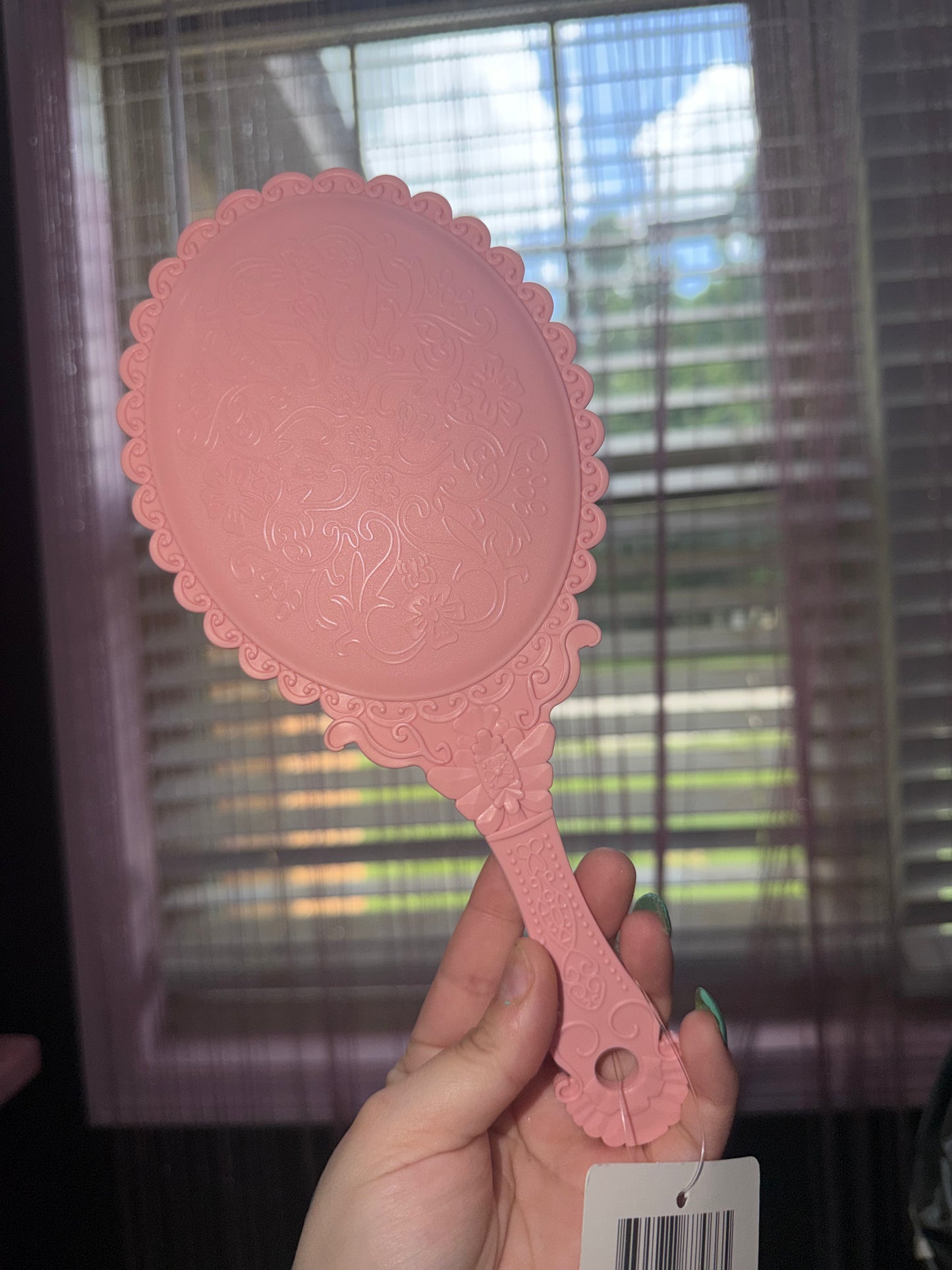Pink hand mirror