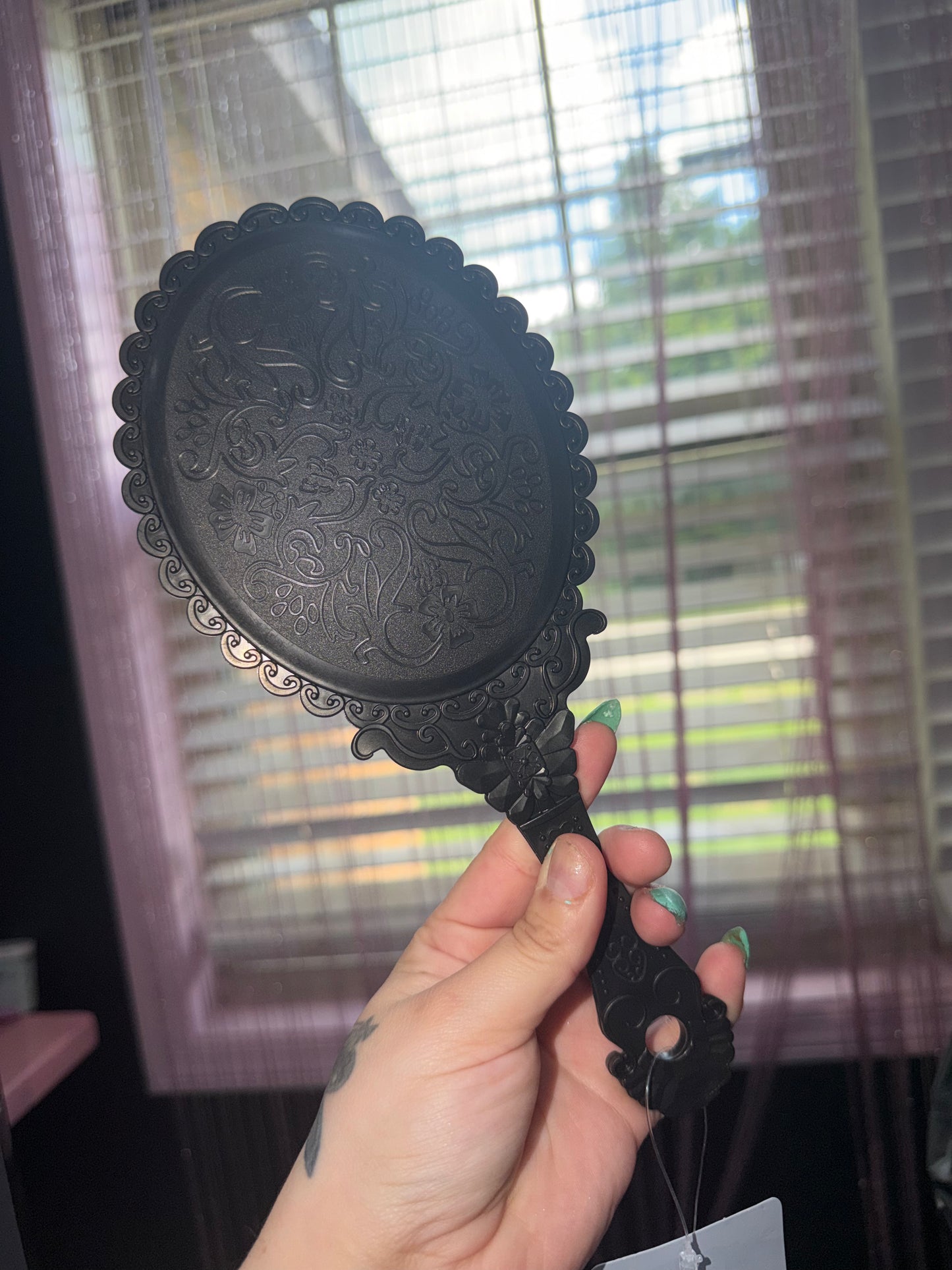 Black hand mirror