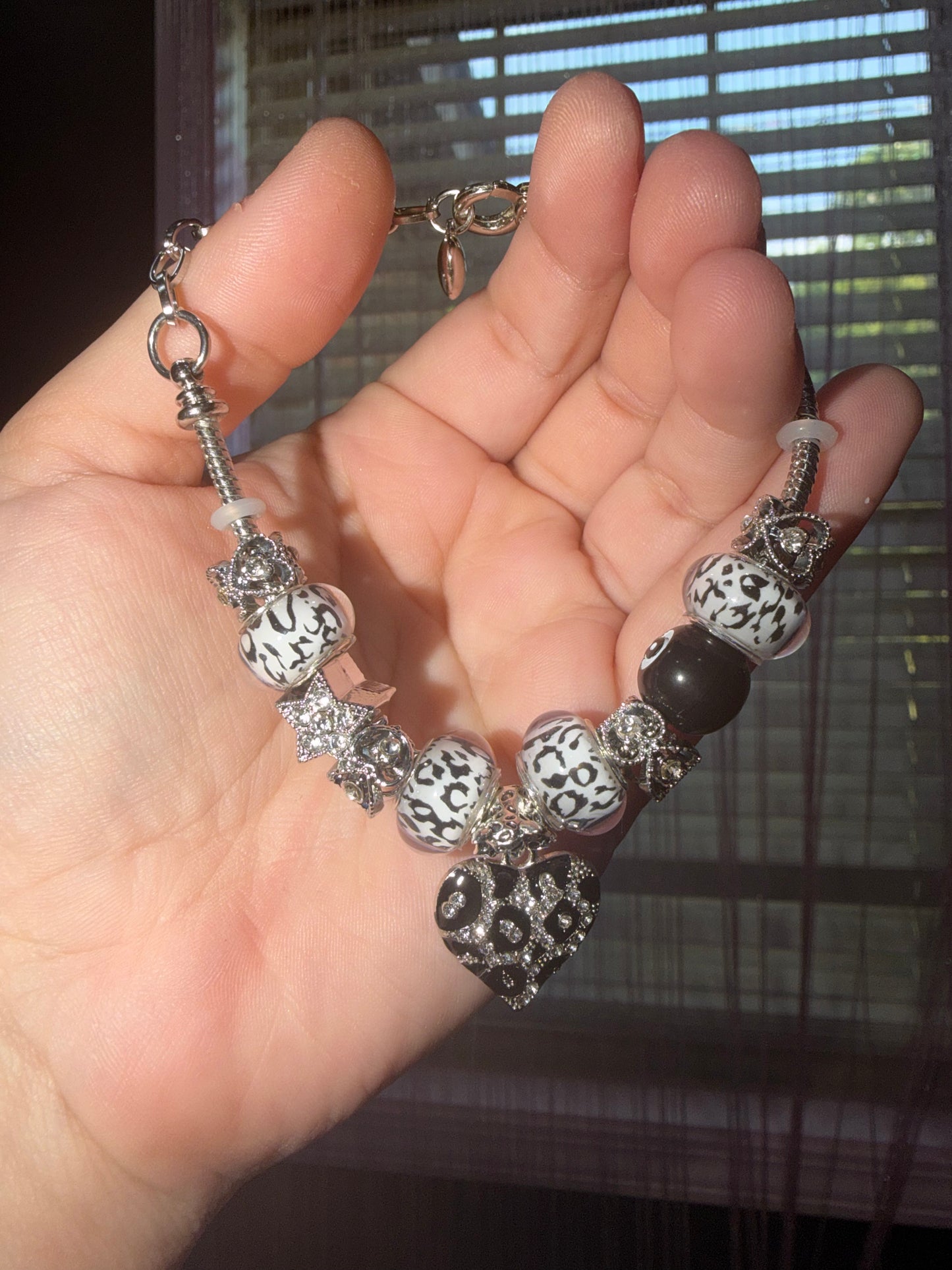 Black and silver cheetah print charm bracelet