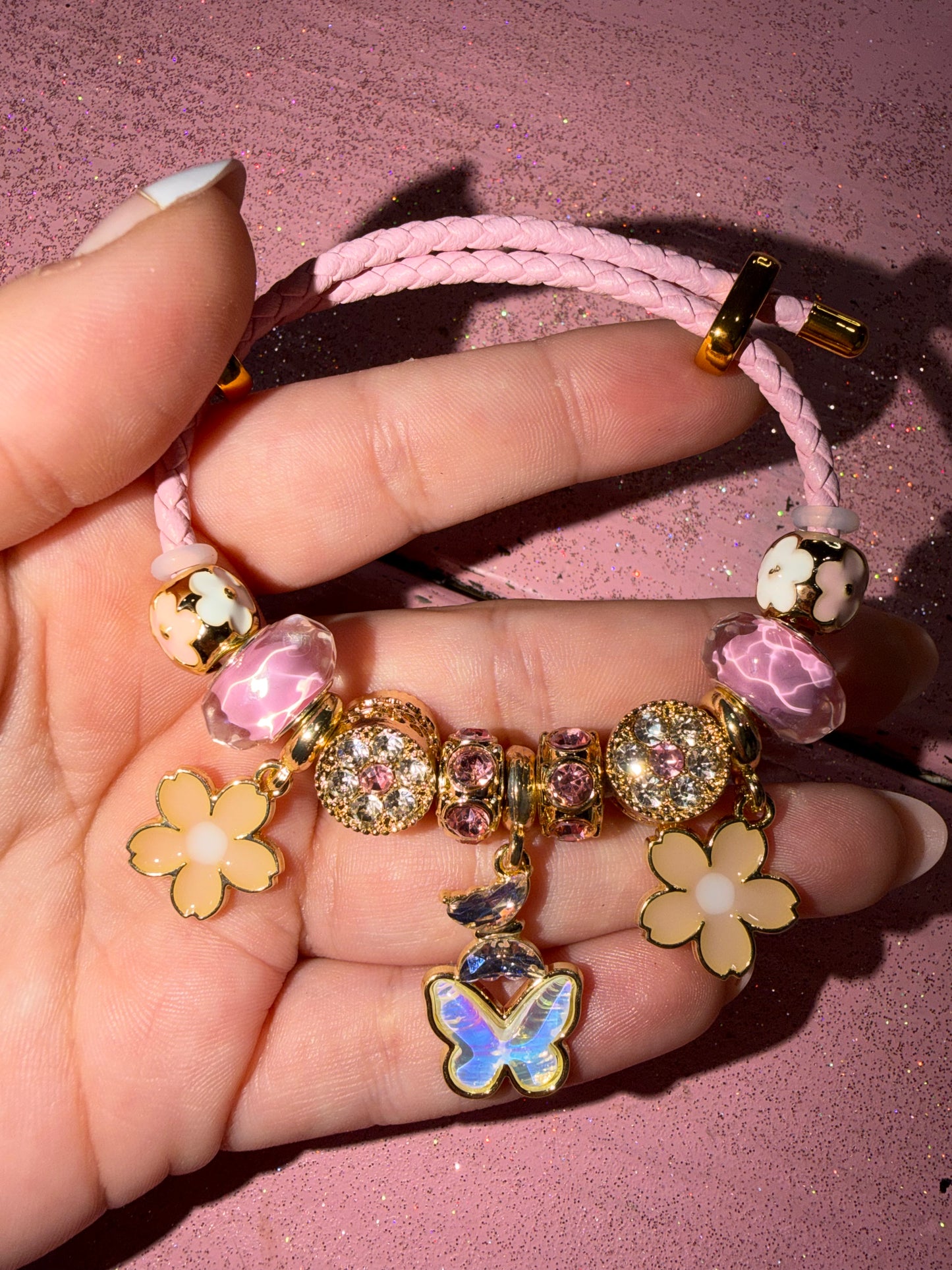 Pink butterfly and flower bracelet