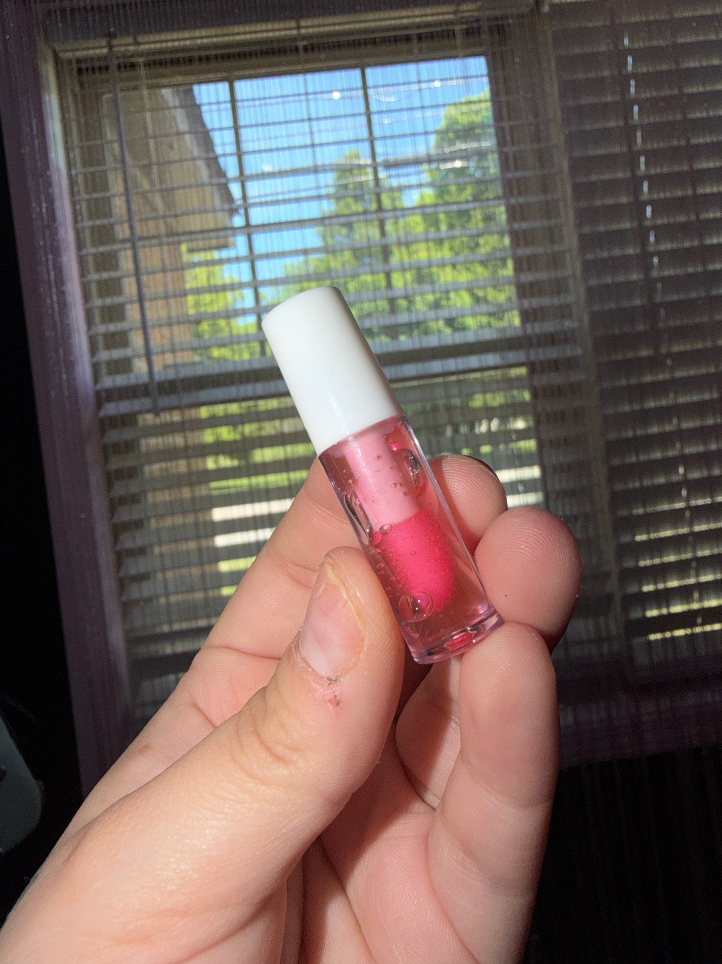 Hot pink lip gloss
