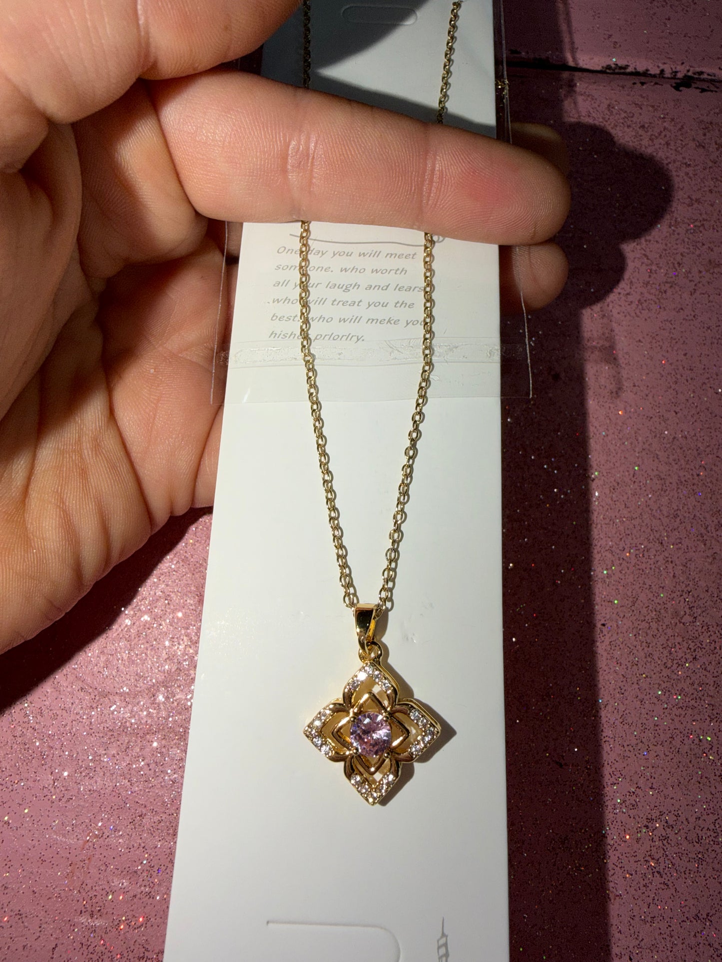 Flower necklace with pink pendant inside