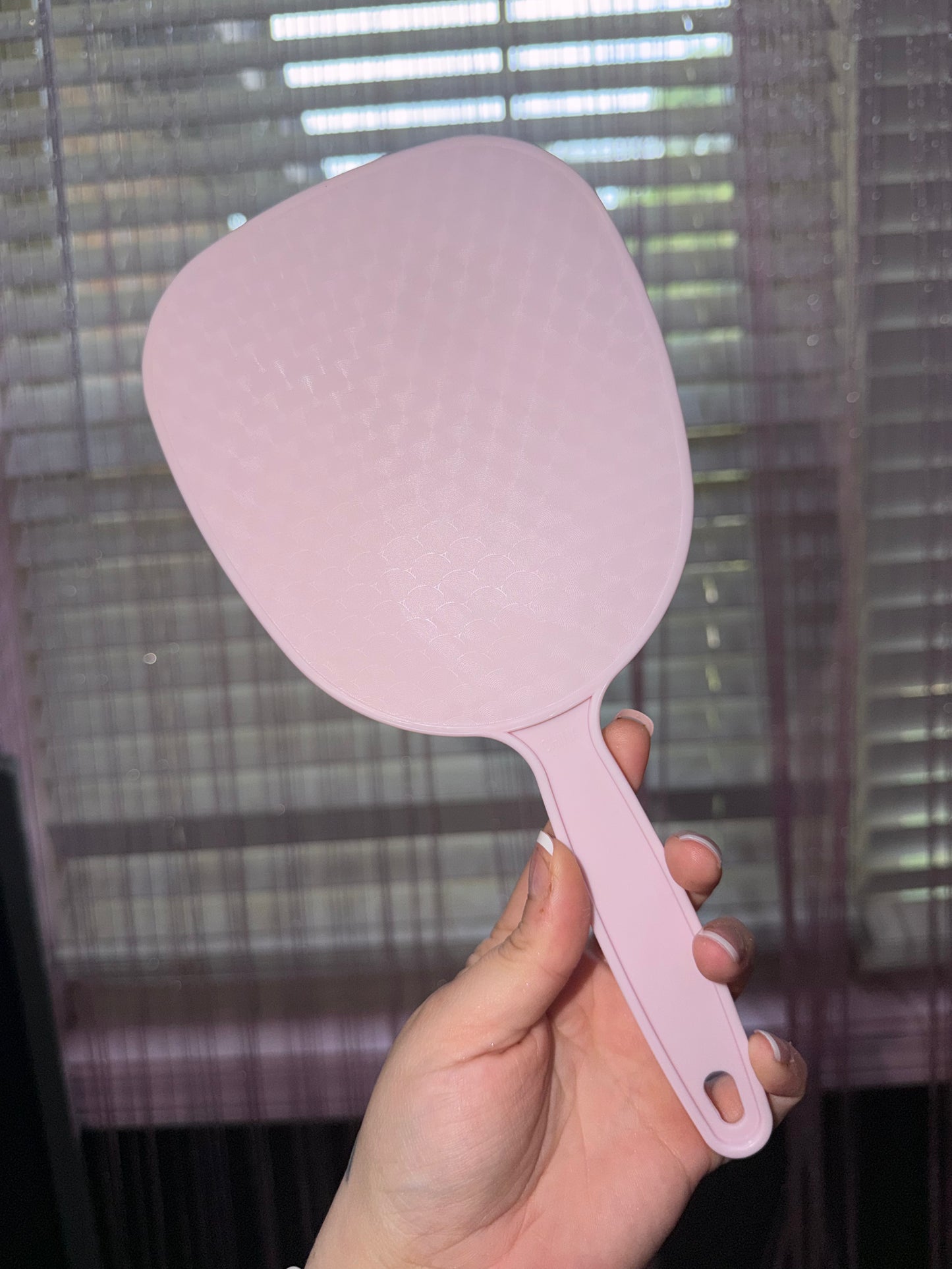 Pink hand held mirror
